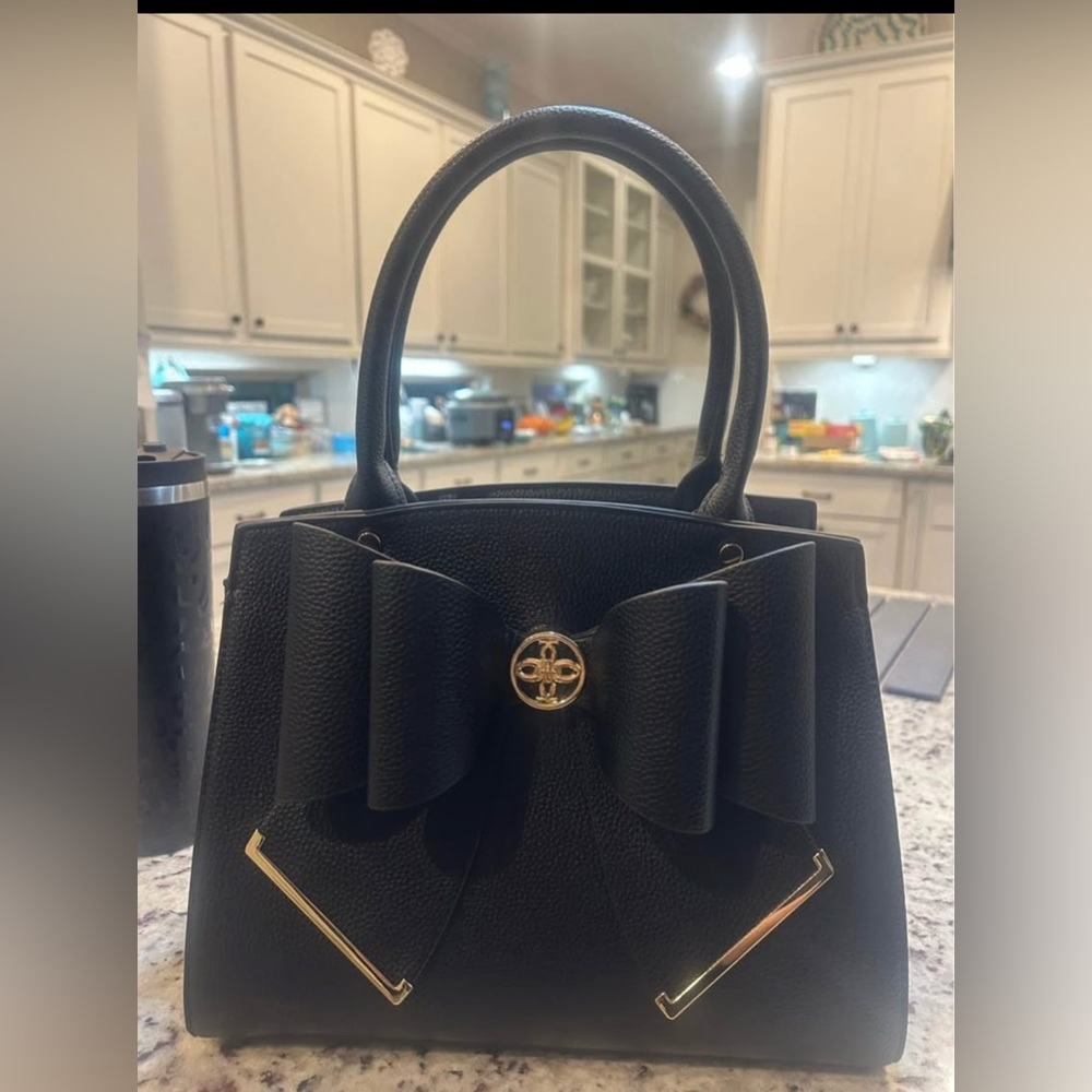 brand new without tags faux leather black handbag with adorable bow detail